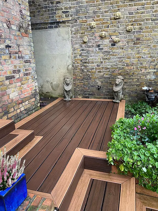 Beautiful composite decking installation with outdoor garden furniture in a London garden