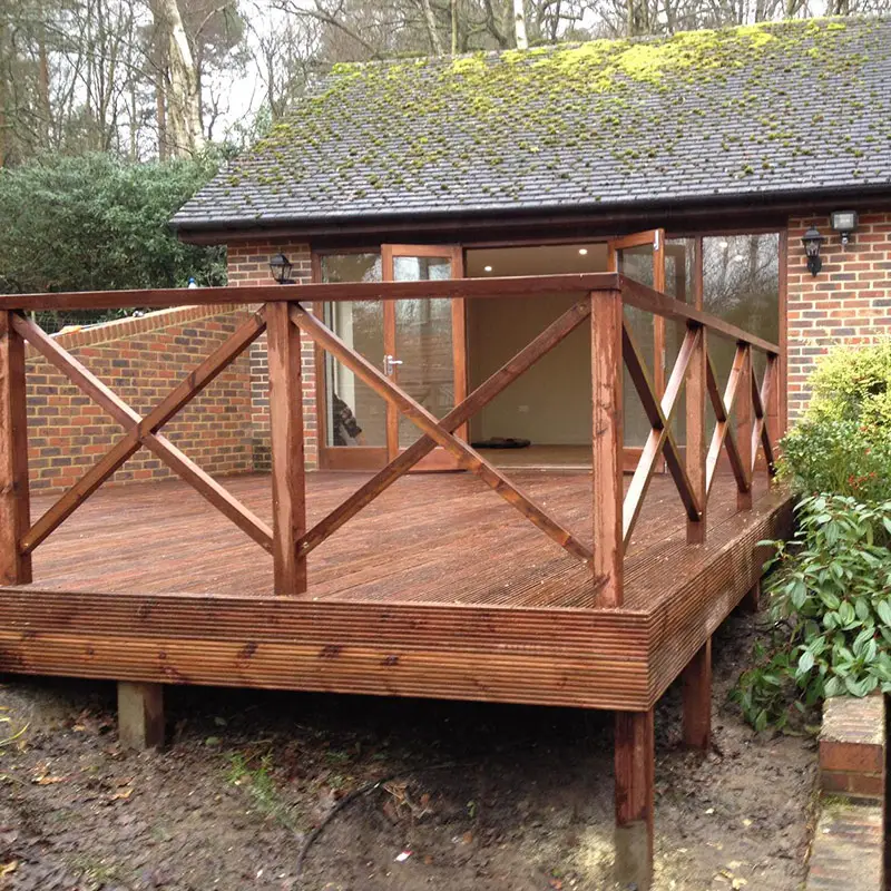 Raised hardwood decking with steps — London residential project