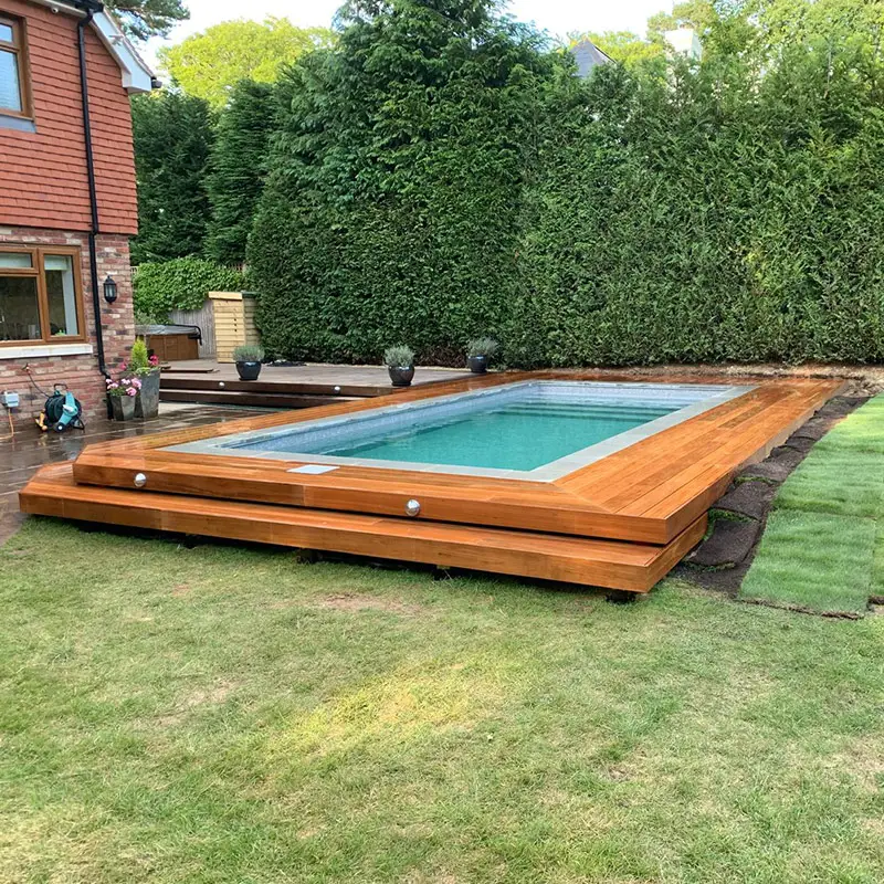 Pool decking installation — hardwood boards around an outdoor pool